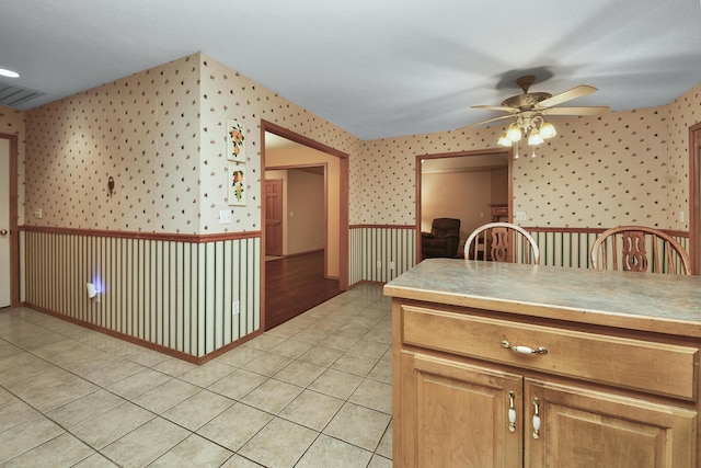 kitchen featuring light tile patterned flooring and ceiling fan