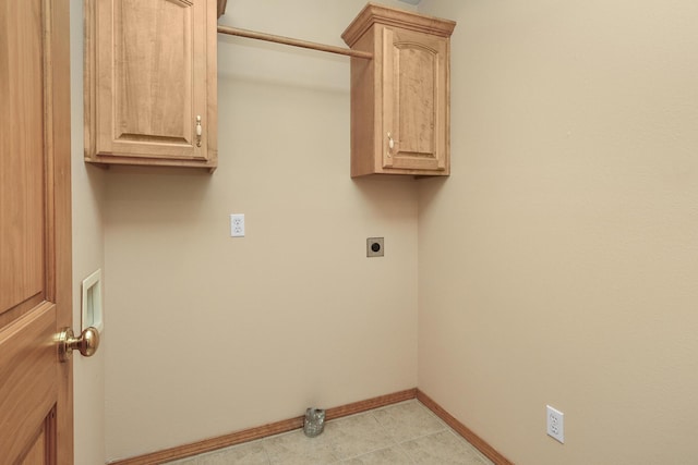 washroom featuring cabinets, light tile patterned flooring, and electric dryer hookup