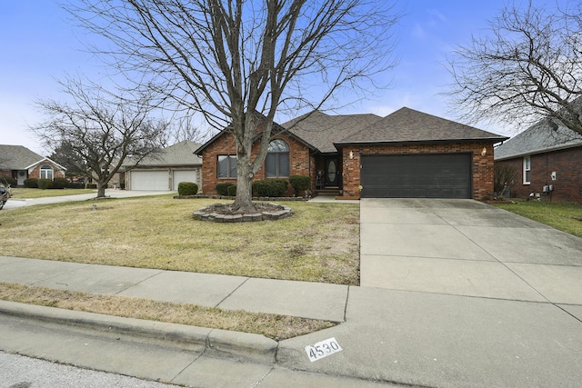 ranch-style home featuring a garage and a front lawn