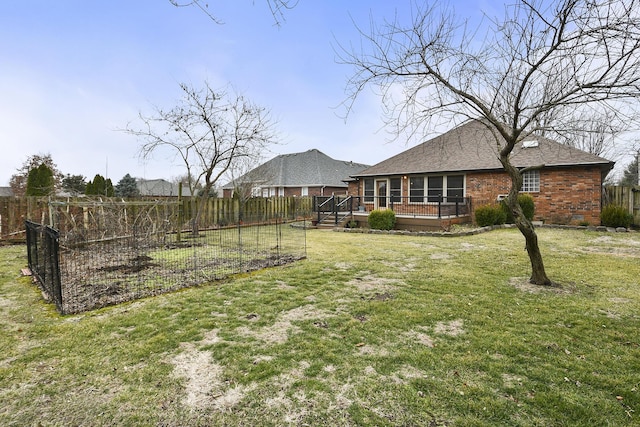 view of yard with a wooden deck