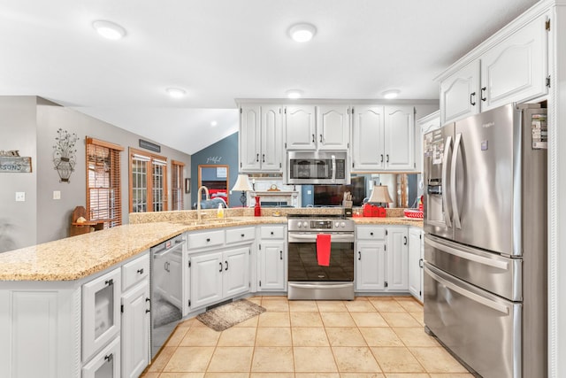 kitchen featuring white cabinetry, kitchen peninsula, and appliances with stainless steel finishes