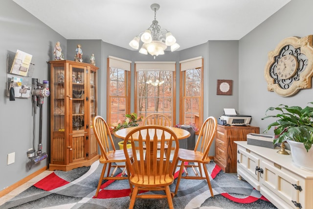 dining space featuring a notable chandelier