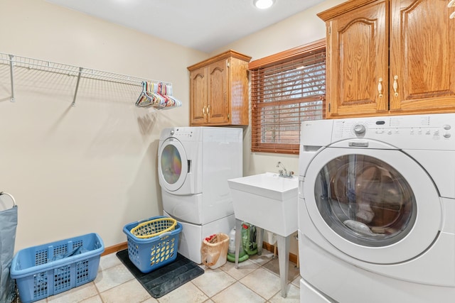 laundry area with cabinets and independent washer and dryer