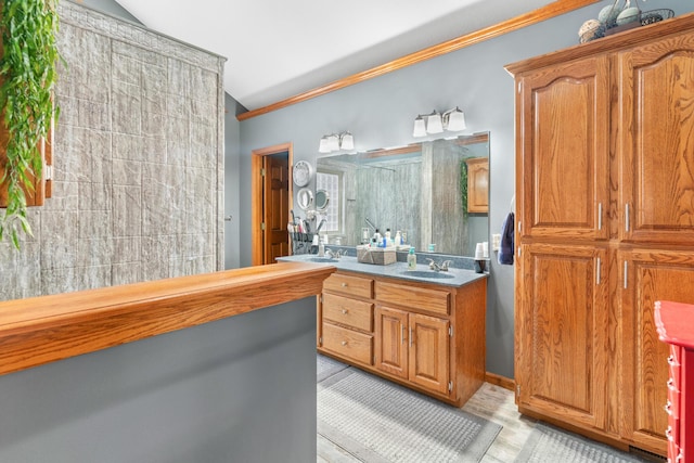 bathroom with vanity and crown molding