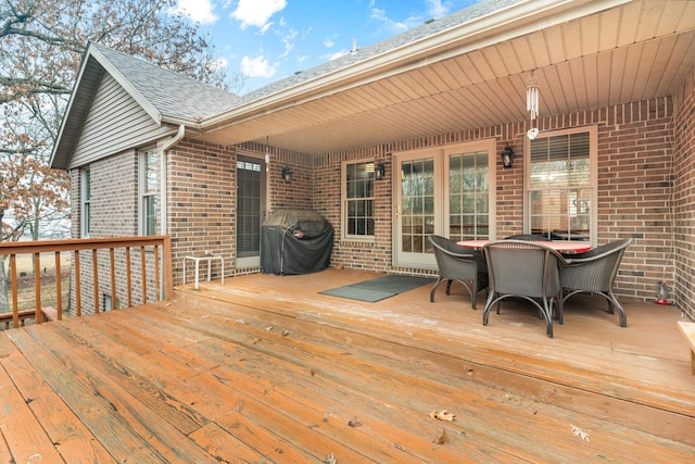 wooden deck featuring area for grilling