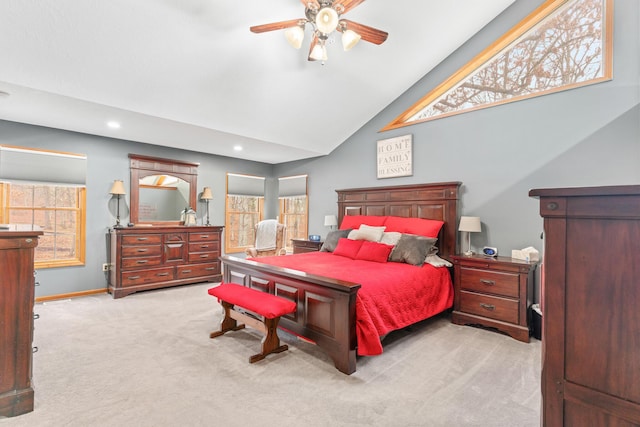 bedroom featuring ceiling fan, light colored carpet, and high vaulted ceiling