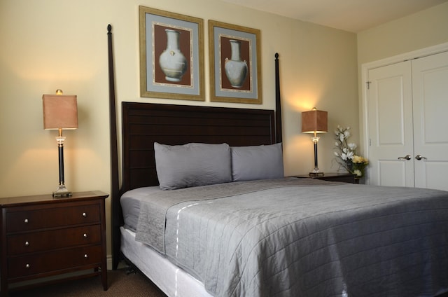 carpeted bedroom featuring a closet