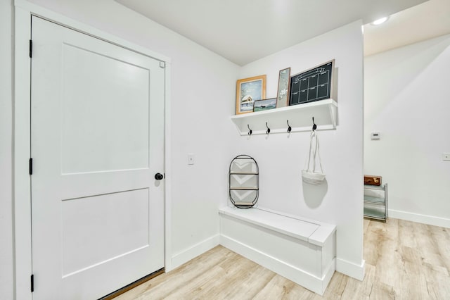 mudroom with light wood-type flooring and baseboards