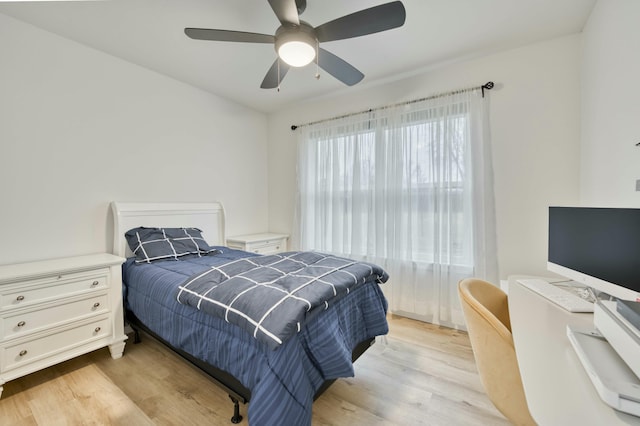 bedroom featuring ceiling fan and light wood-style flooring