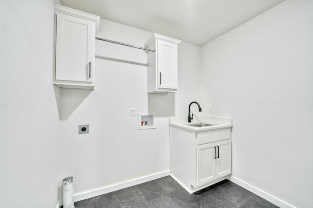 laundry area with baseboards, washer hookup, cabinet space, electric dryer hookup, and a sink