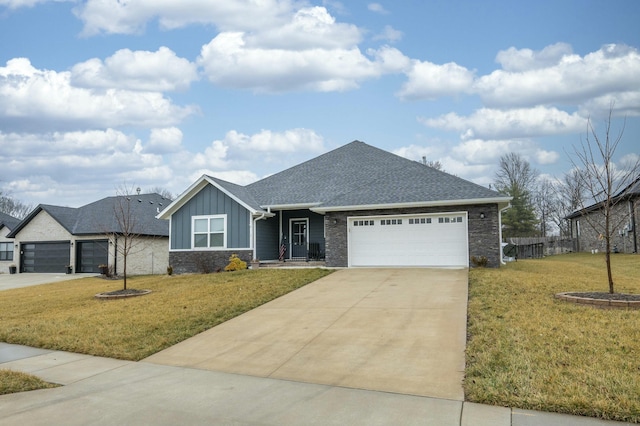 ranch-style home featuring a front yard, an attached garage, and board and batten siding