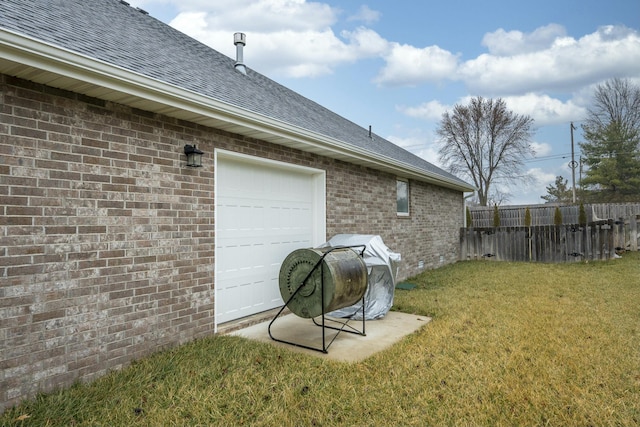 exterior space with an attached garage and fence