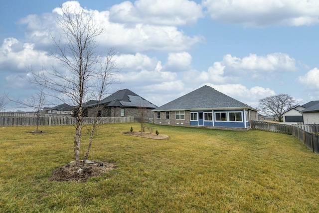 view of yard with a fenced backyard