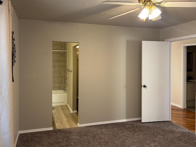 unfurnished bedroom featuring ceiling fan and light colored carpet