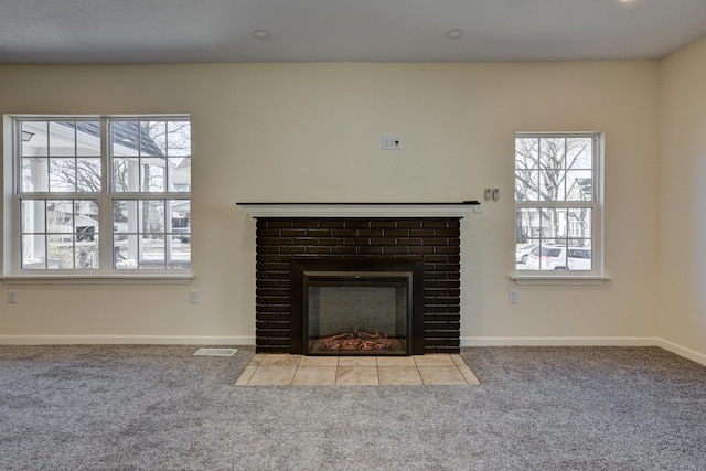 room details with a brick fireplace and carpet flooring