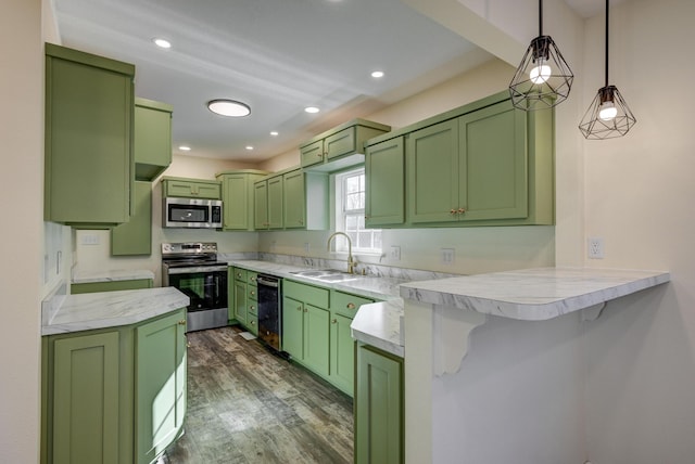 kitchen with green cabinetry, appliances with stainless steel finishes, and kitchen peninsula