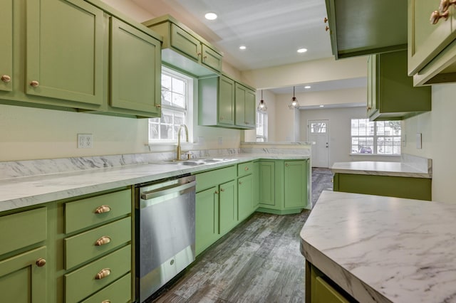 kitchen featuring sink, decorative light fixtures, stainless steel dishwasher, and green cabinetry