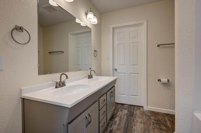 bathroom with vanity and hardwood / wood-style floors