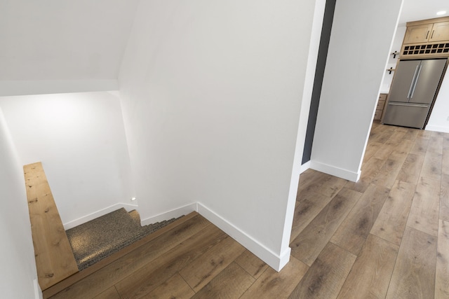 staircase featuring wood-type flooring