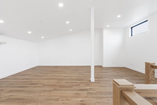 basement with light hardwood / wood-style floors