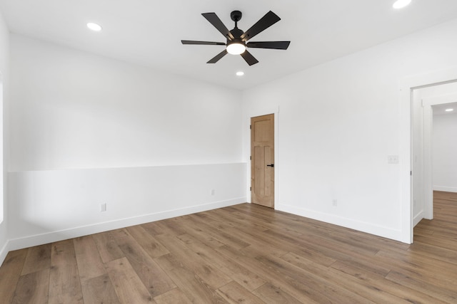 unfurnished room featuring hardwood / wood-style flooring and ceiling fan