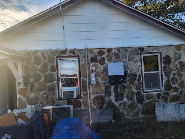 view of side of property featuring cooling unit