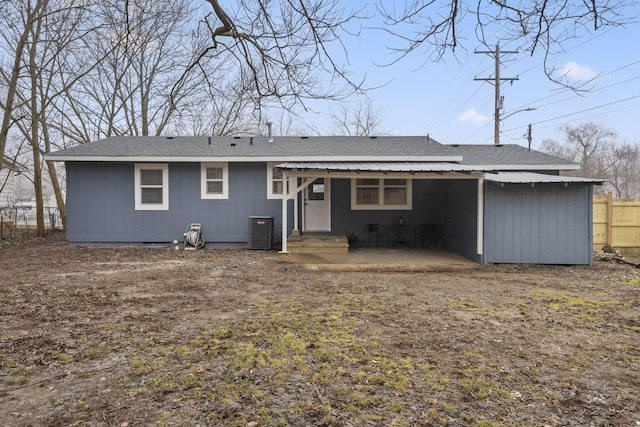 rear view of house with cooling unit and a patio area