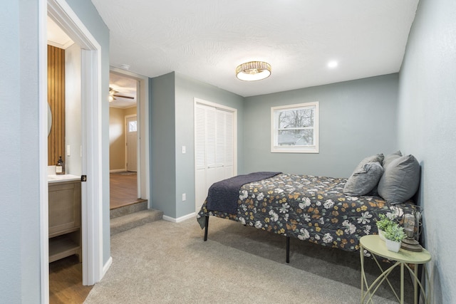 carpeted bedroom featuring a closet