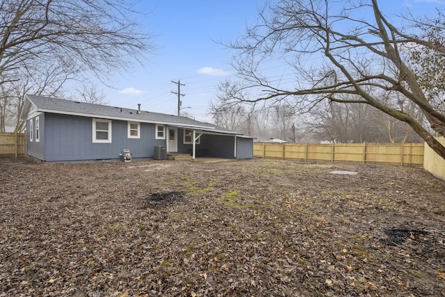 rear view of property with central air condition unit