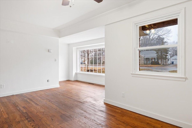 unfurnished room with hardwood / wood-style flooring and ceiling fan