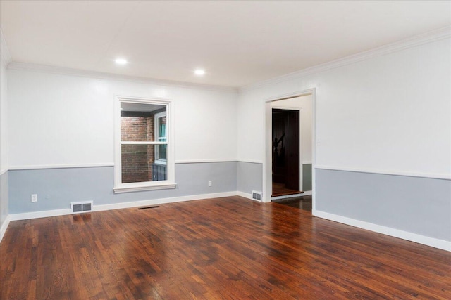 unfurnished room with ornamental molding and dark hardwood / wood-style floors