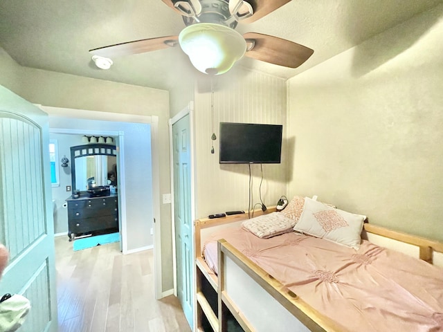 bedroom with ceiling fan and light wood-type flooring