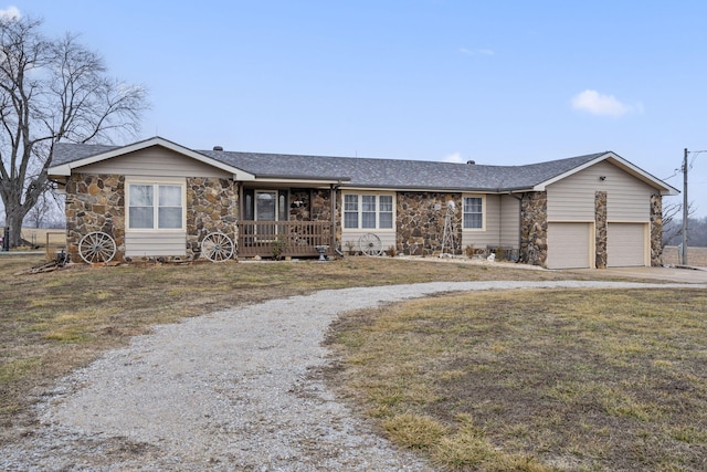 single story home with a garage and a front yard