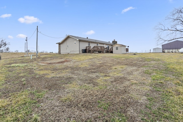 view of yard with a wooden deck