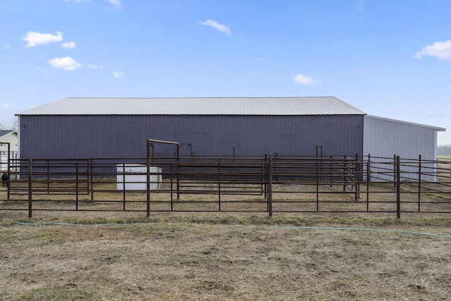 view of yard with an outdoor structure and a rural view