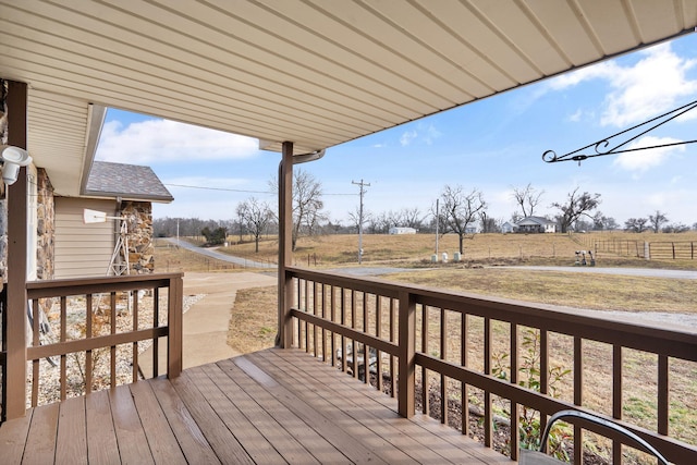 wooden terrace featuring a rural view