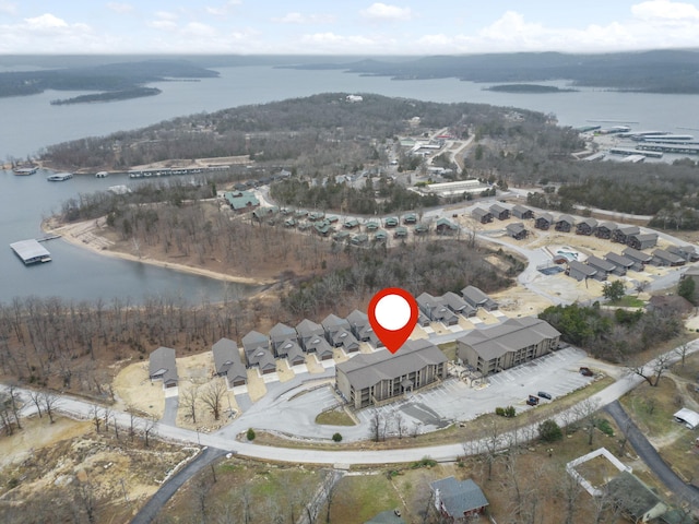 bird's eye view featuring a water view and a residential view