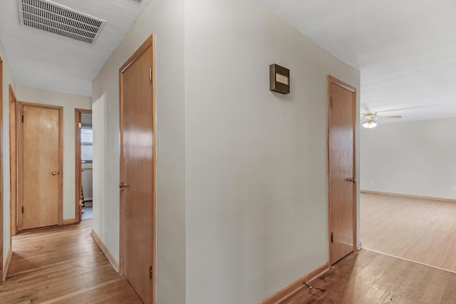 corridor featuring light hardwood / wood-style floors