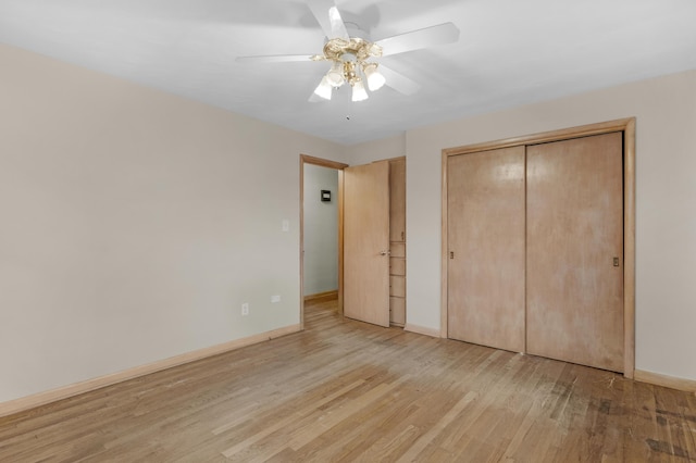 unfurnished bedroom featuring a closet, ceiling fan, and light wood-type flooring