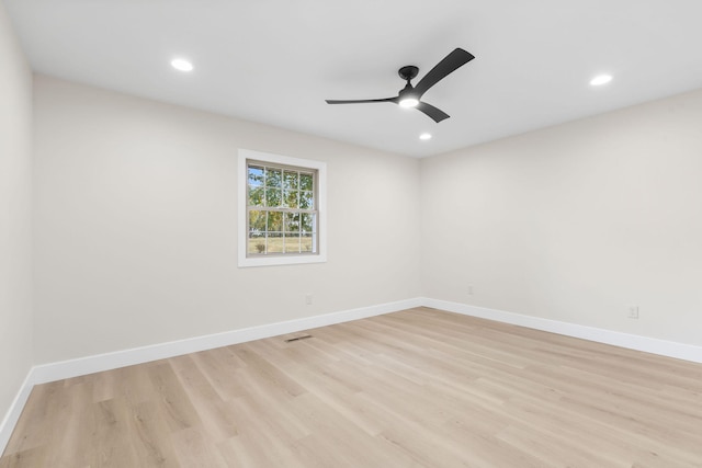 unfurnished room with ceiling fan and light wood-type flooring