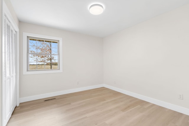 unfurnished room featuring light wood-type flooring