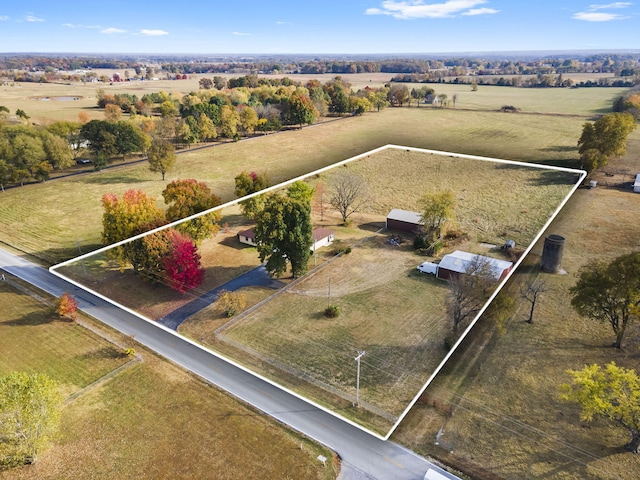 birds eye view of property featuring a rural view