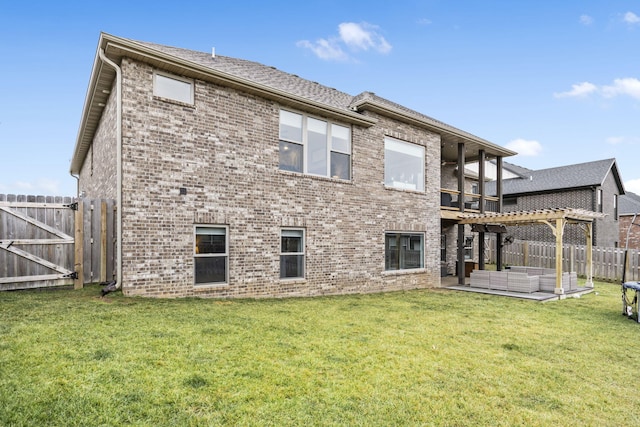 rear view of property featuring a balcony, a patio, an outdoor hangout area, and a lawn