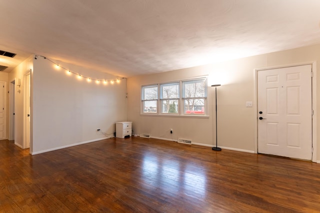 unfurnished room featuring dark hardwood / wood-style flooring