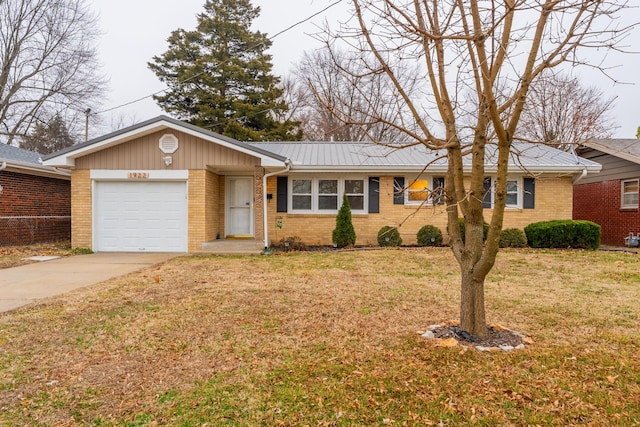 ranch-style home with a garage and a front lawn