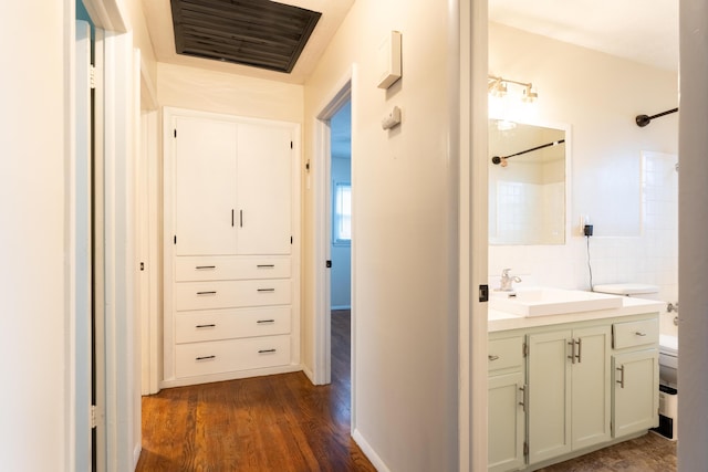 hall with sink and dark hardwood / wood-style floors