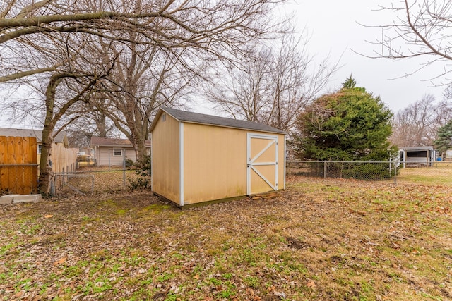 view of outdoor structure featuring a lawn