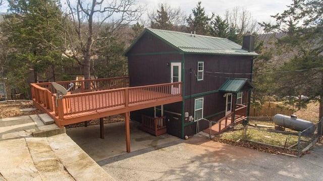 back of property with a wooden deck