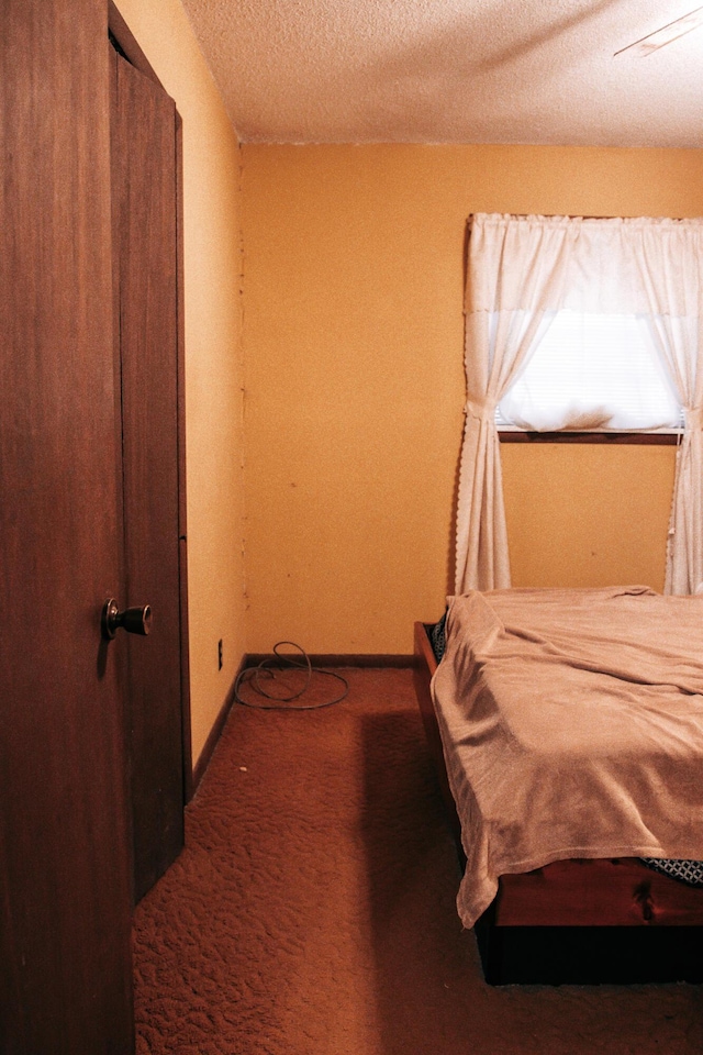 17162 Edgewood Dr, Winona, MO 65588 - carpeted bedroom with a textured ceiling