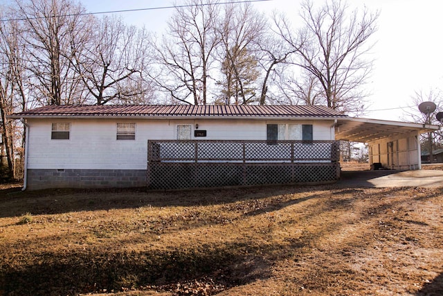 17162 Edgewood Dr, Winona, MO 65588 - rear view of house featuring a wooden deck and a carport